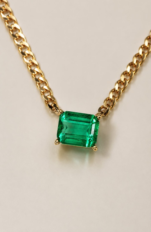 Emerald on curb chain necklace in 18k gold